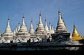 Myanmar - Mandalay, Sandamuni Pagoda. The entire ground is covered with 1749 small white pagodas with stone slabs with the Buddhist Tripitaka. 